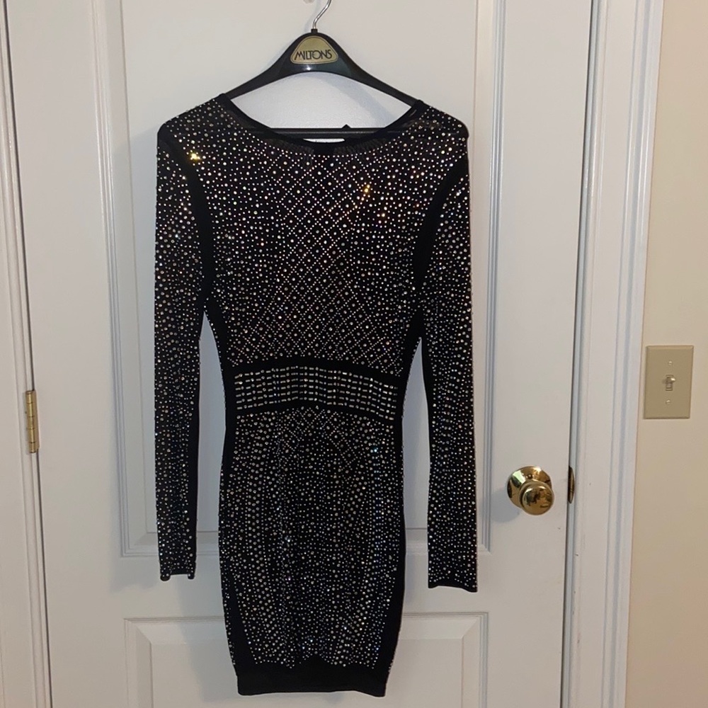 Semi-sheer black body con dress very sparkly & perfect for special events.